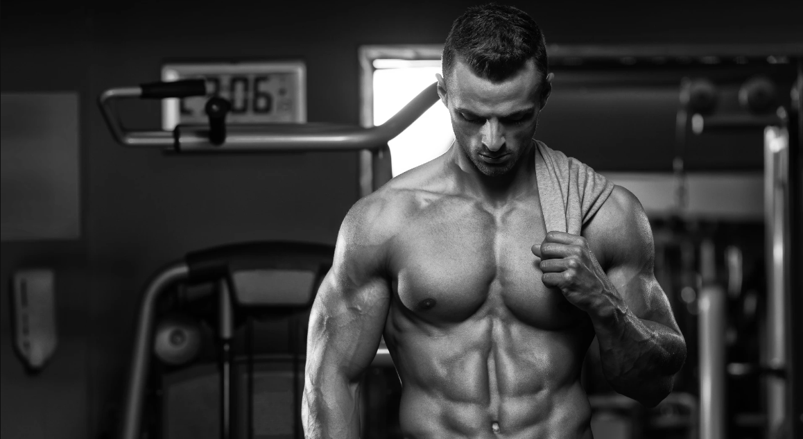 A shirtless man in the gym