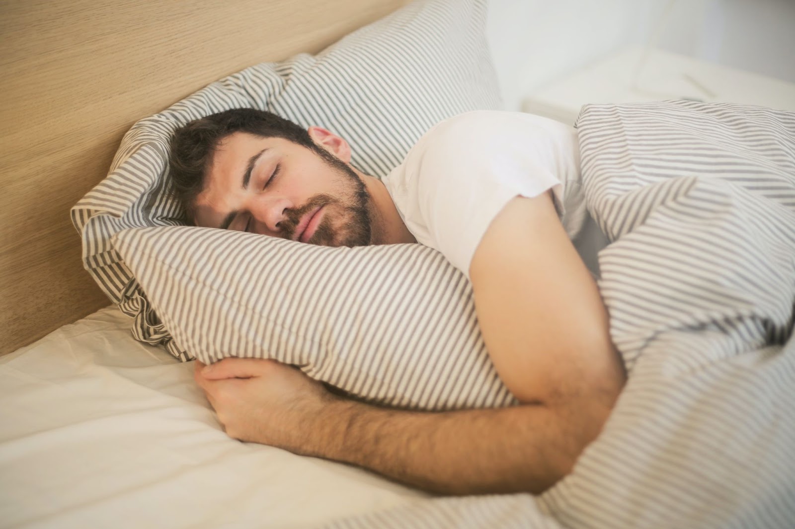 A man sleeping on a bed