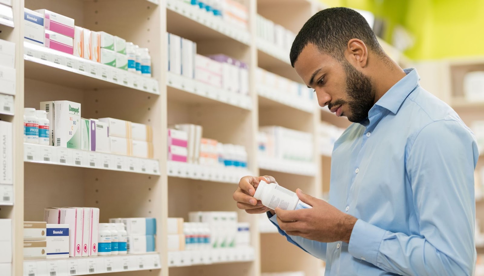 A man choosing the right Ashwagandha supplement in a drugstore