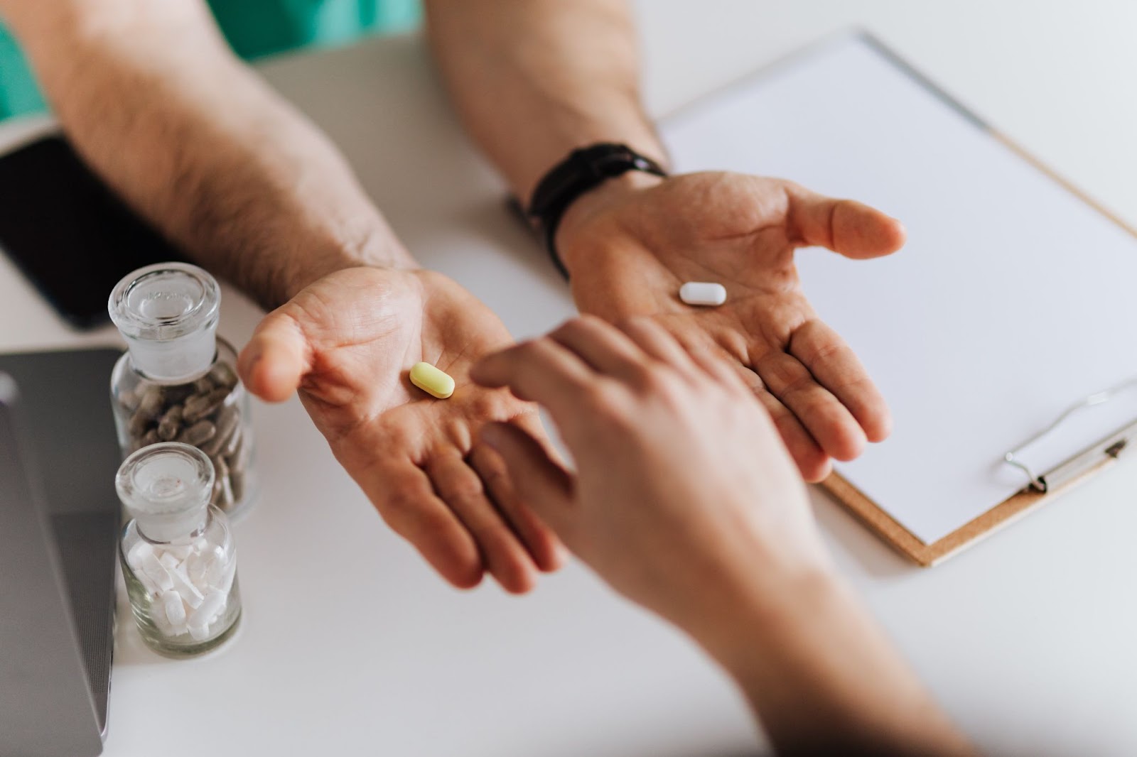 A doctor’s hands with ashwagandha supplements