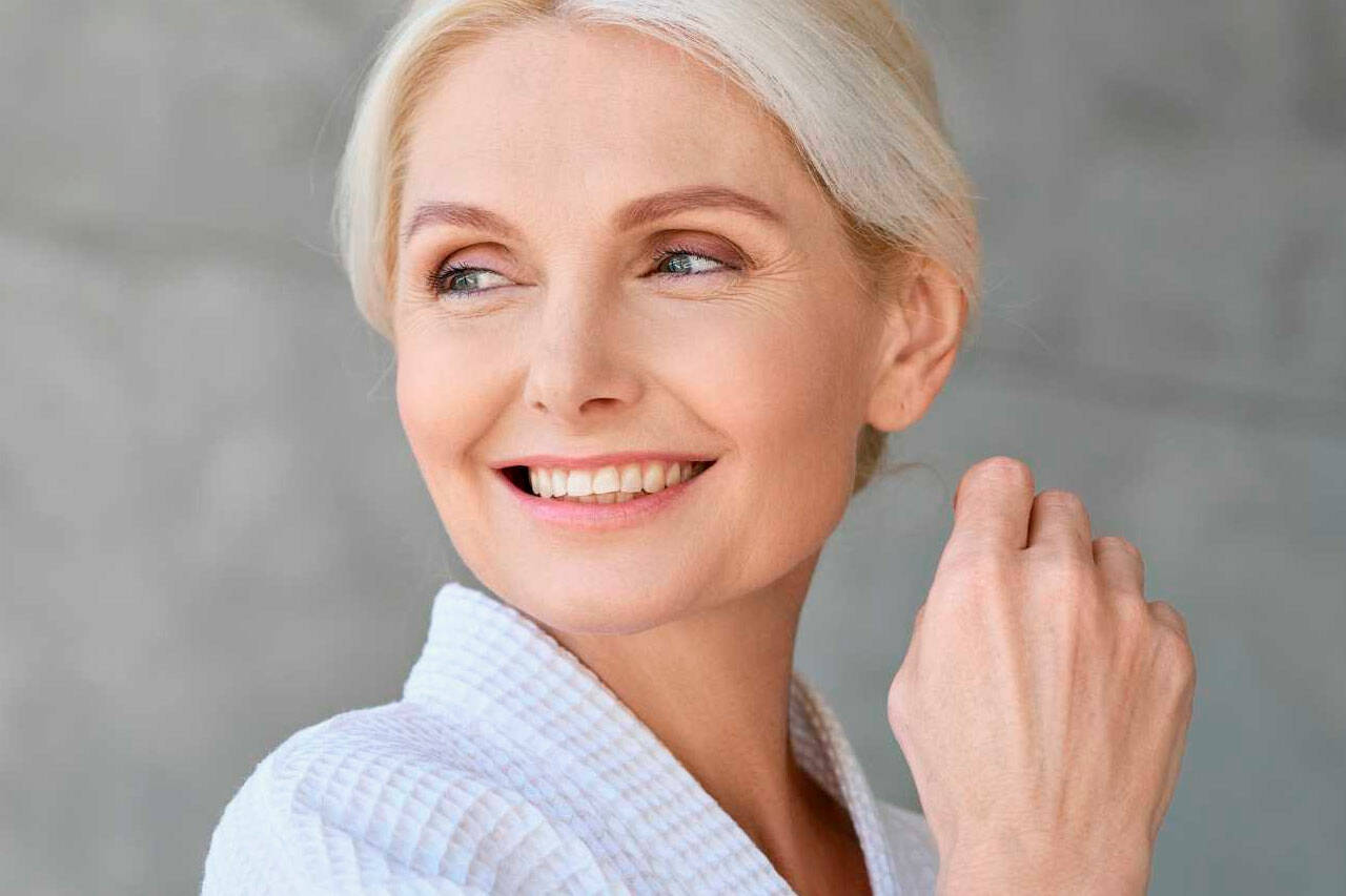 A liposomal NMN supplement user smiling