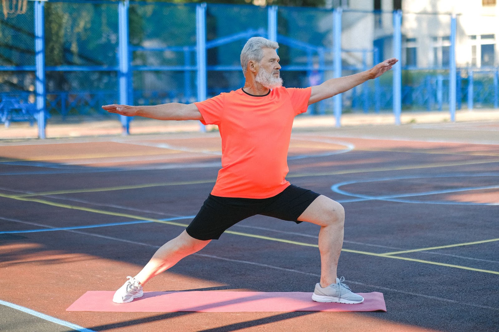 A man stretching on a mat