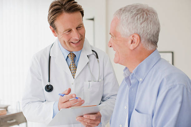 a doctor talking to a male patient